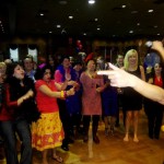 Luisa Marshall as Tina Turner at the 7th Annual Kick Up Your Heels for International Women's Day 2012 singing with fans.