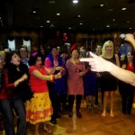 Luisa Marshall as Tina Turner at the 7th Annual Kick Up Your Heels for International Women's Day 2012 singing with fans.