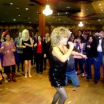 Luisa Marshall as Tina Turner at the 7th Annual Kick Up Your Heels for International Women's Day 2012 singing.