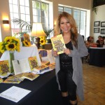 Luisa Marshall holding a copy of the book she's in at CBS Studio in Los Angeles 2012 for The Philippines in Hollywood Book Launch.