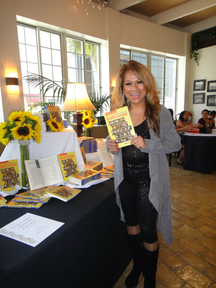 Luisa Marshall holding a copy of the book she's in at CBS Studio in Los Angeles 2012 for The Philippines in Hollywood Book Launch.