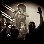 Black & white picture of Luisa Marshall as Tina Turner at the PNE Tribute Stage 2012. The crowd sings along with Luisa Marshall as Tina Turner at the PNE Tribute Stage 2012. Tina Turner Tribute.