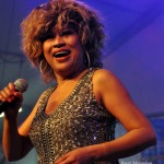 Luisa Marshall as Tina Turner at the PNE Tribute Stage 2012 in a silver dress. Tina Turner Tribute.