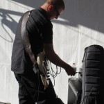 Luisa Marshall's bass player Jason Nickel sets up before the Harmony Arts Festival 2012.