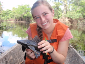 Becky Friesen holding a "some sort of ancient Amazonian fish" during her research trip in Peru.