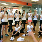 Contestants cheering Michelle Apples on during her wall sit.