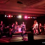 Luisa Marshall's band and dancers rock out to Tina Turner's version of Addicted to Love.